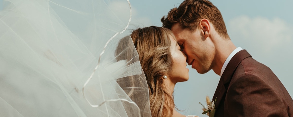 bride and groom kissing