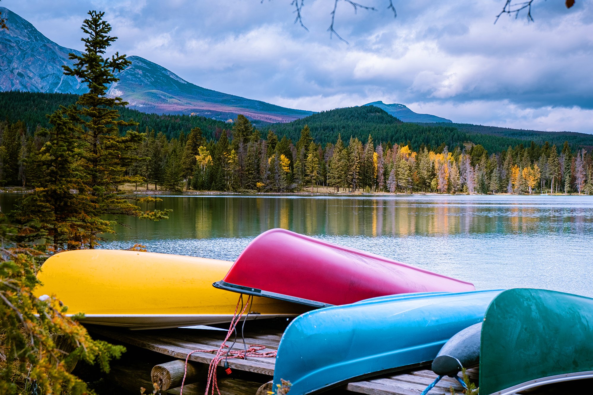 Canoe on dock beside lake