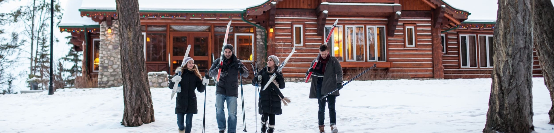 two couple walking with cross country skis