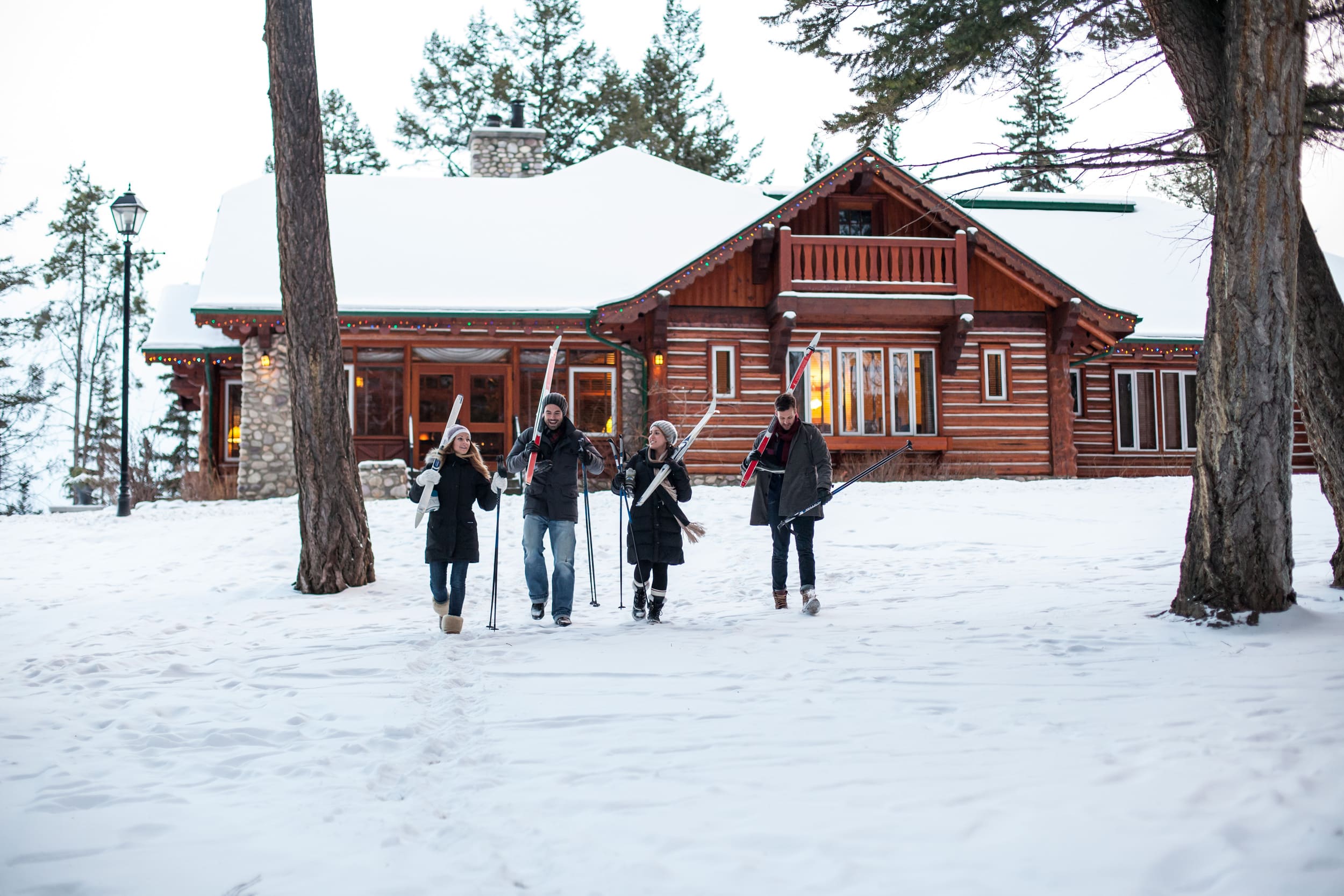 two couple walking with cross country skis