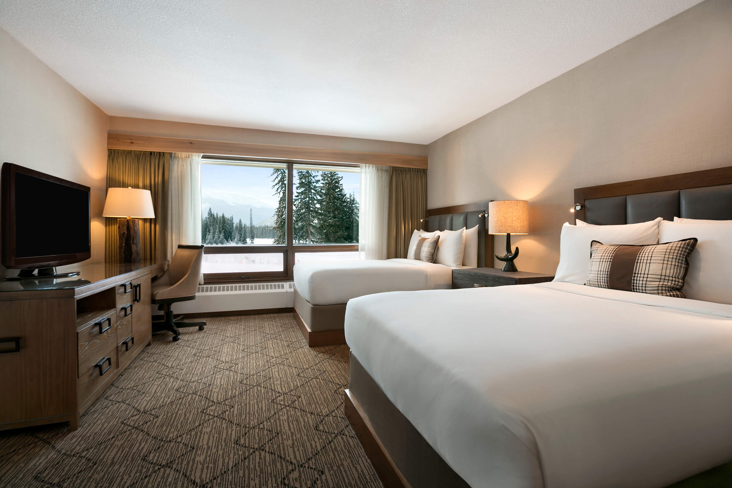 bedroom with two beds and desk