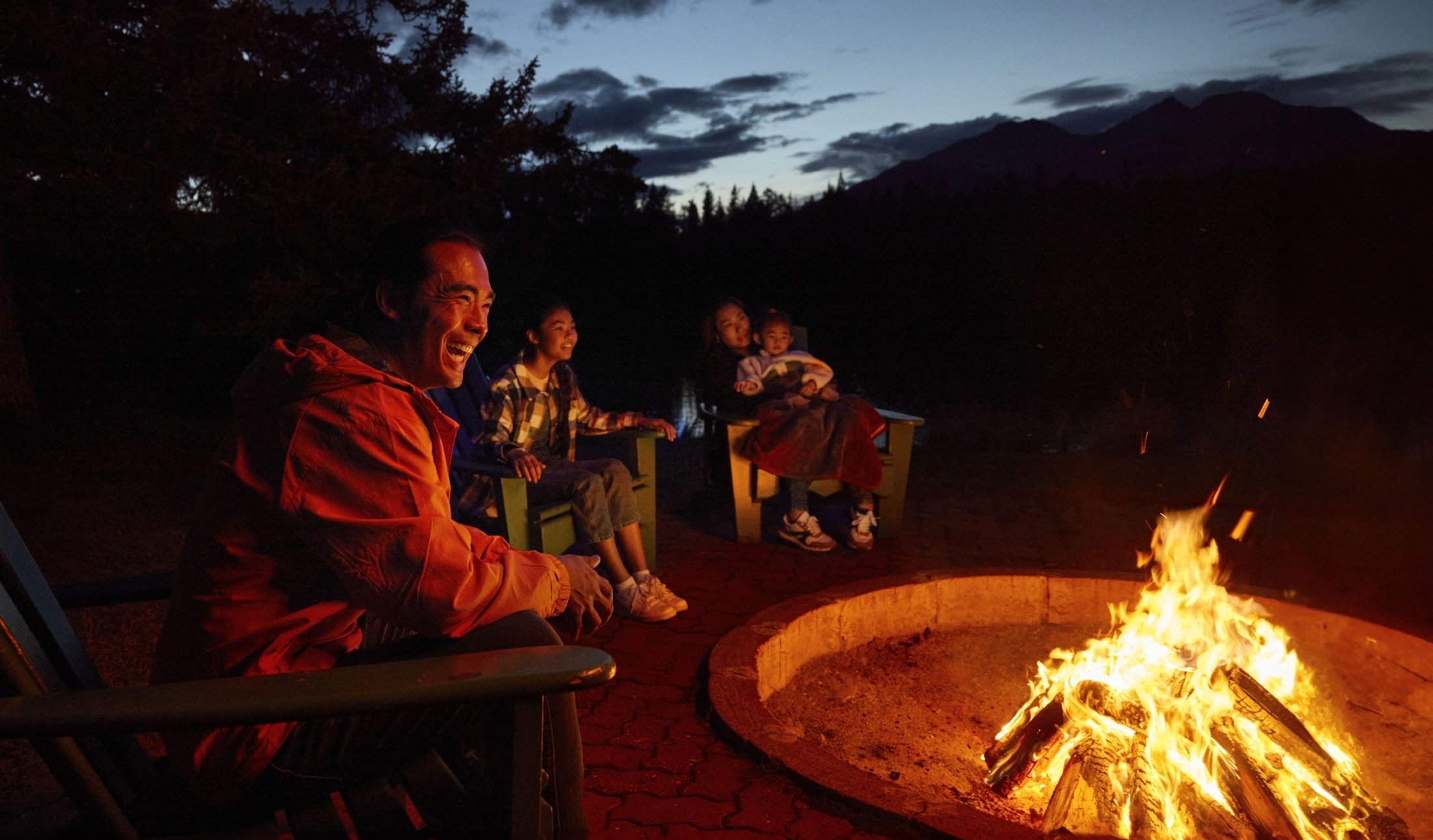 A cozy family Campfire at Trefoil Lake at Fairmont Jasper Park Lodge