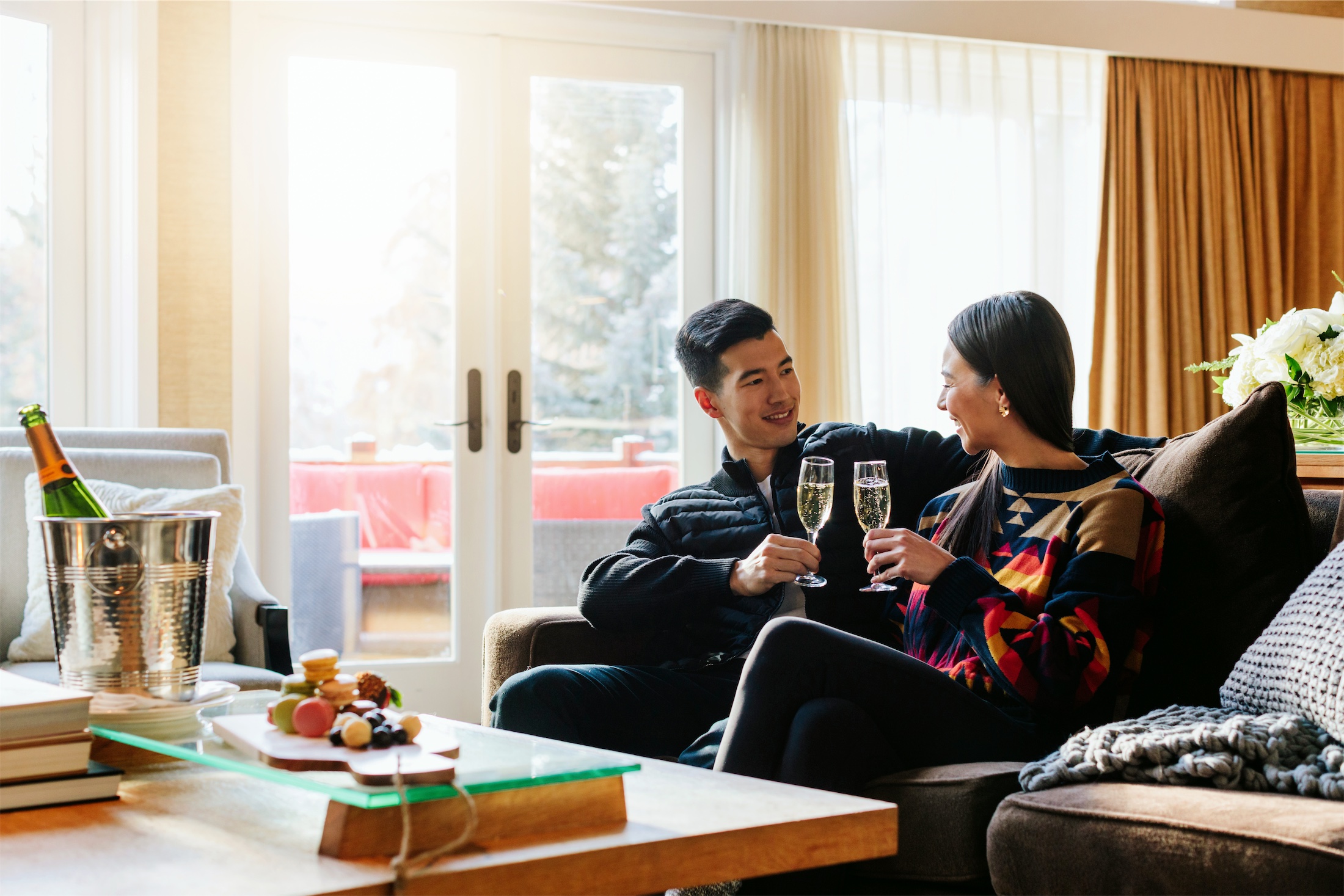 couple with champagne in stanley thompson cabin