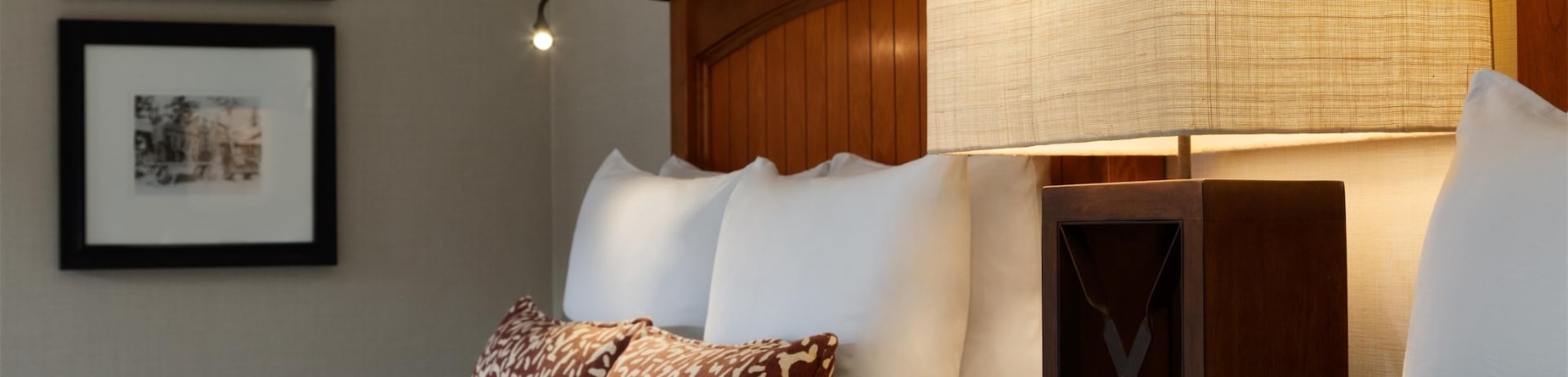 double beds with night stand in the middle