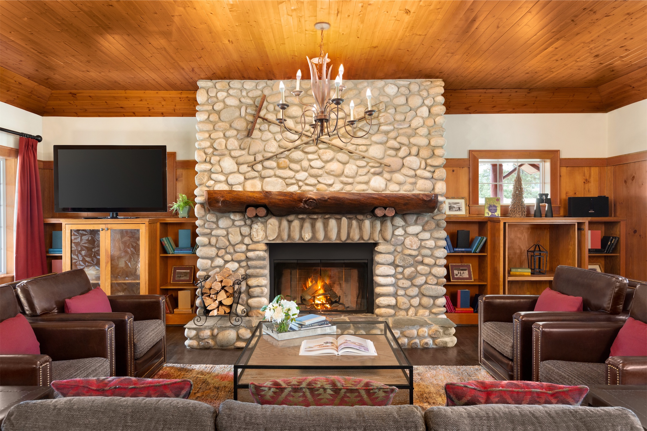 indoor fireplace in the living room of gardeners cabin