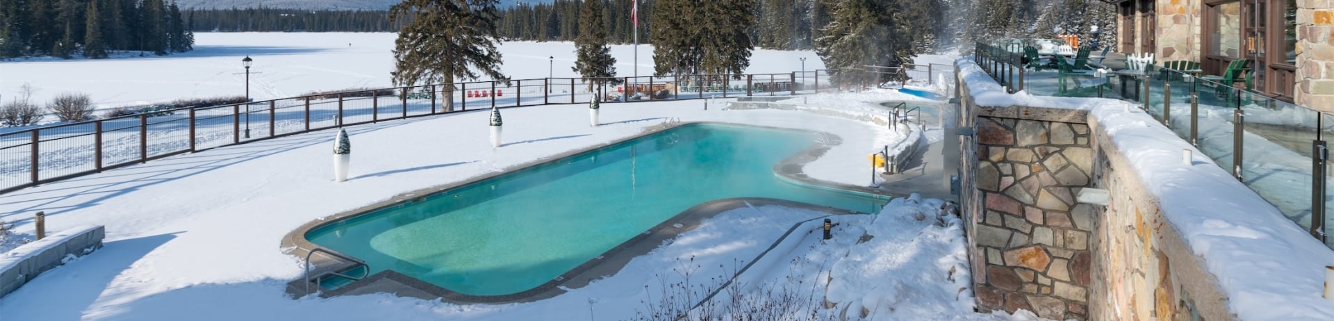 outside pool in winter next to mountains