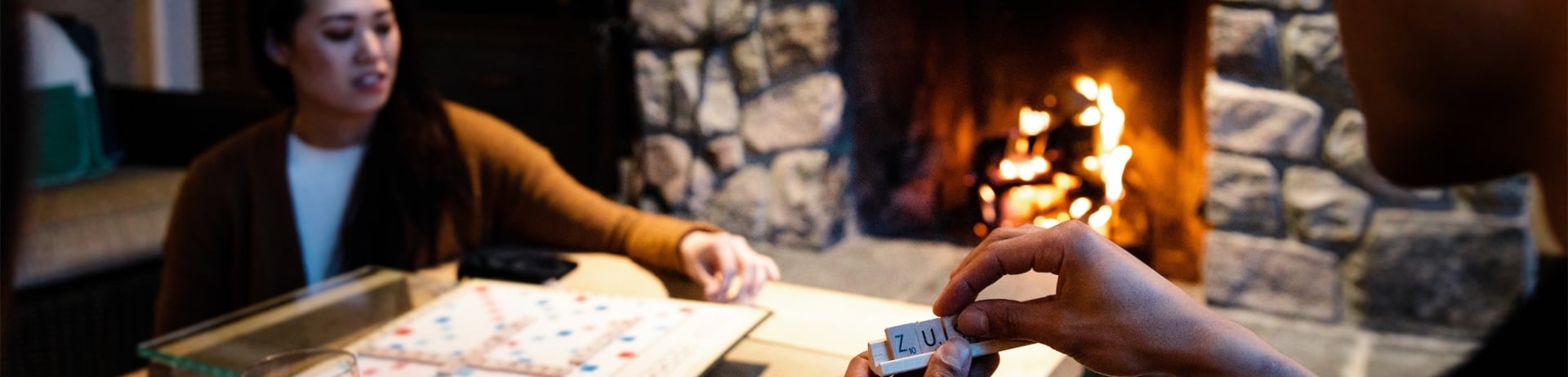 signature cabin fireplace board games and drinks