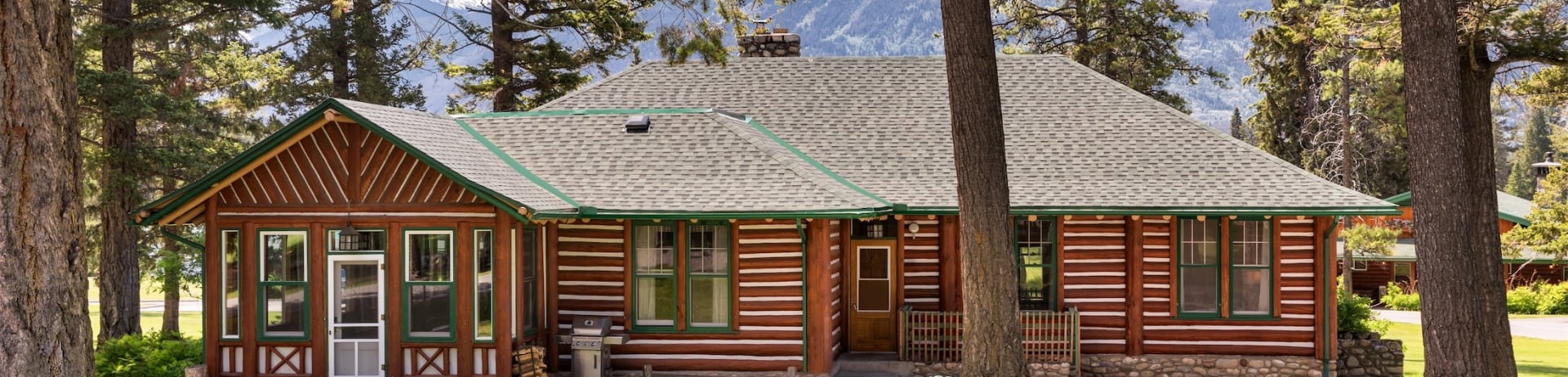 exterior of wood cabin and mountains