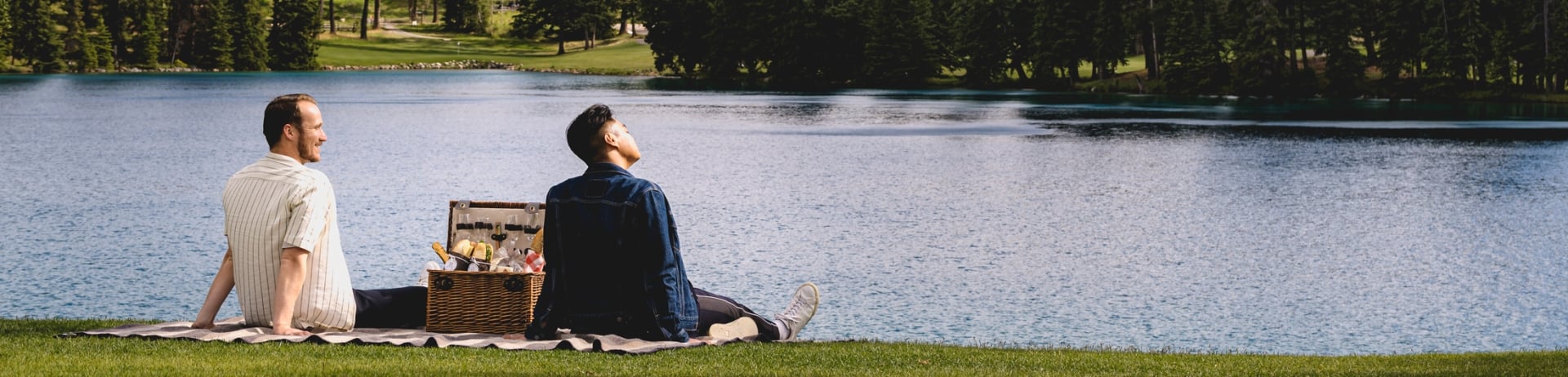 couple enjoying picnic by the lake