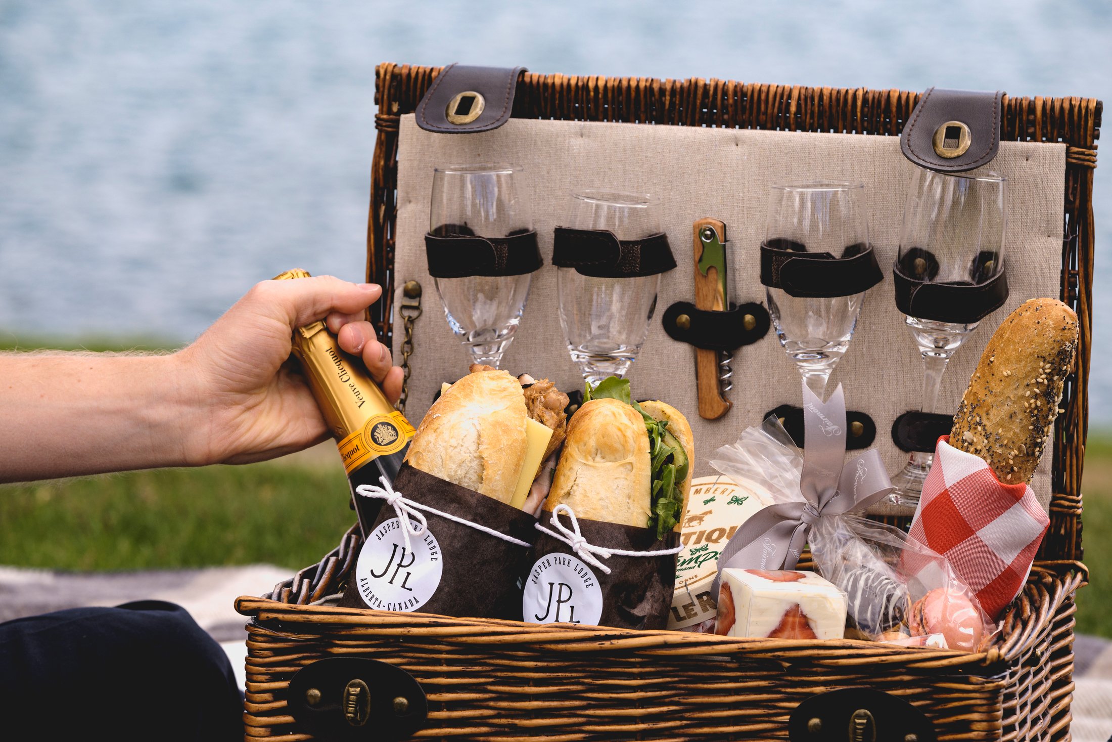 closeup of picnic basket and champagne