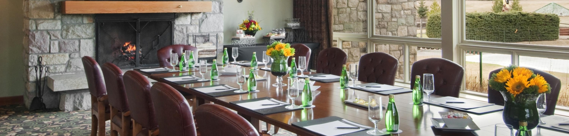 A long meeting table in a rustic lodge