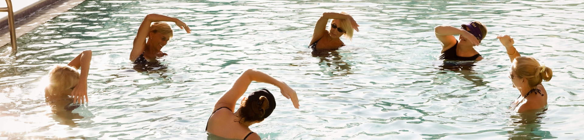 women in an pool exercise group class
