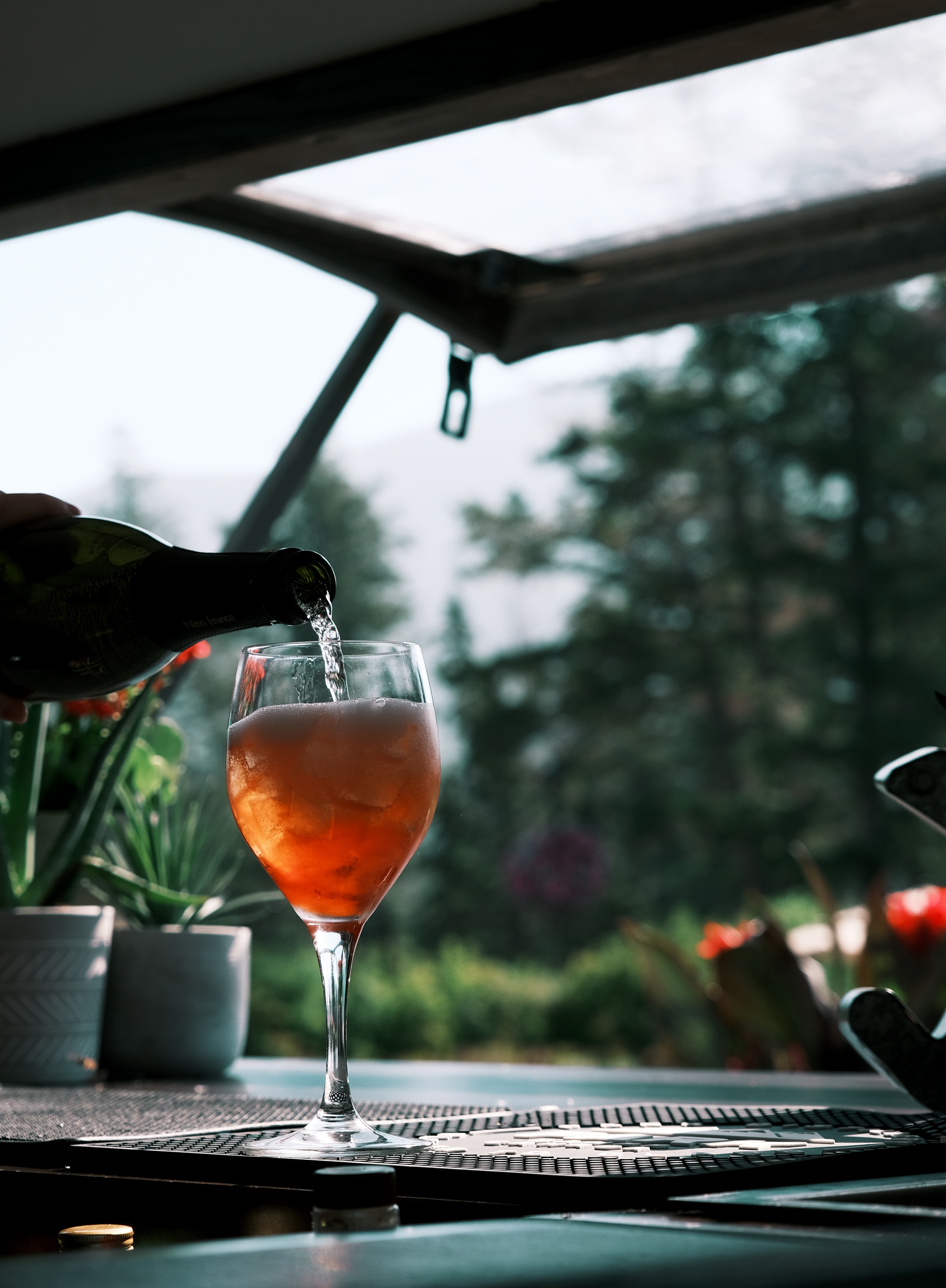 Champagne is poured into a spritz drink at Jasper Park Lodges poolside bar.