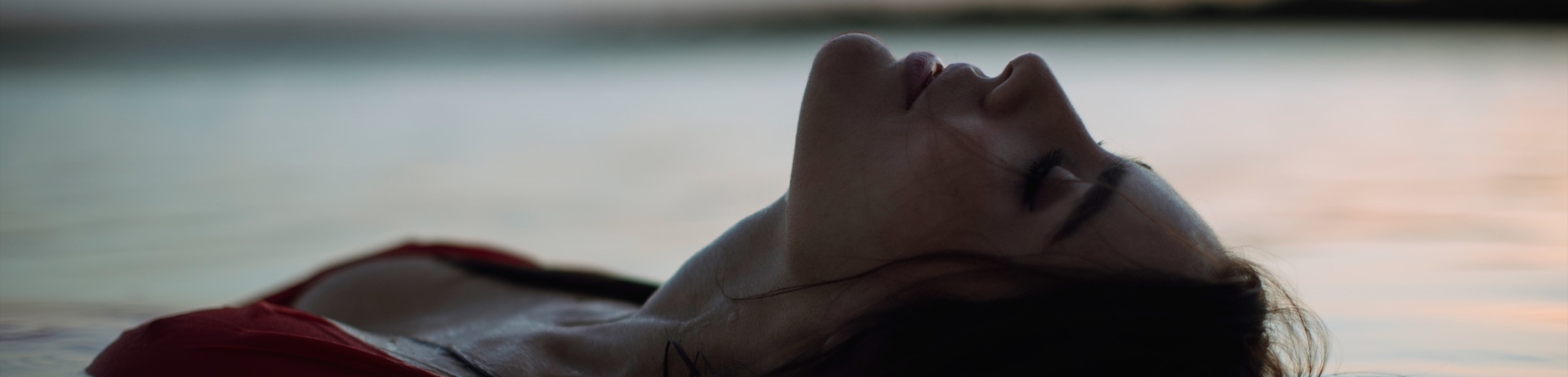 woman floating in a pool