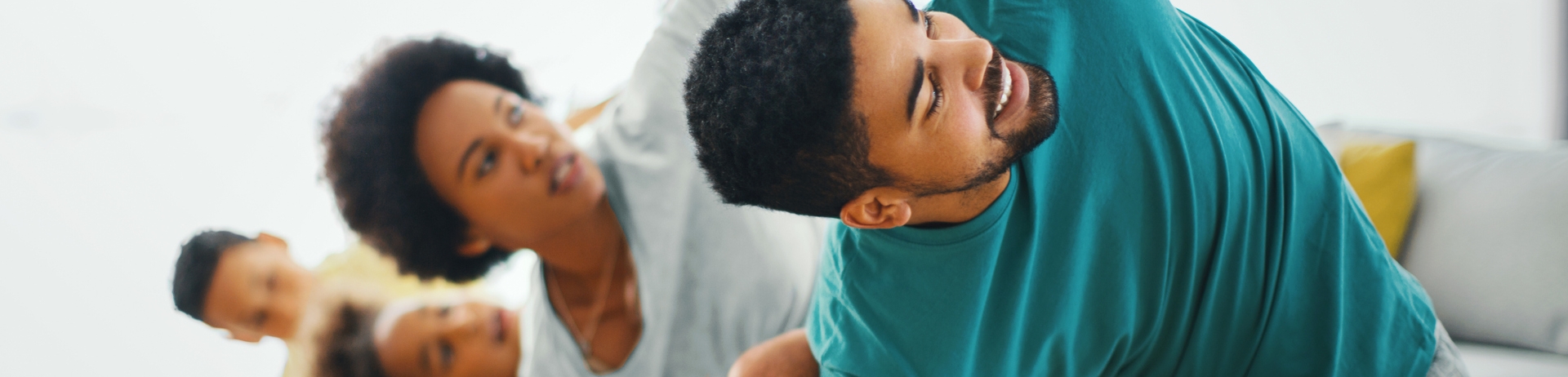 Family exercising at home.