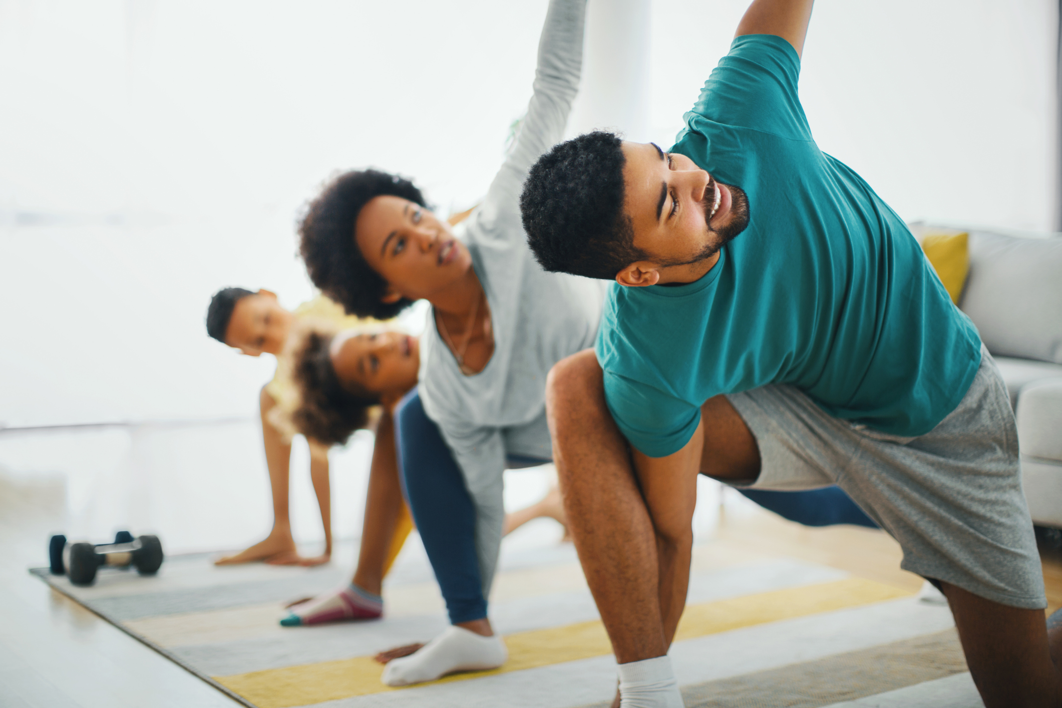 Family exercising at home.