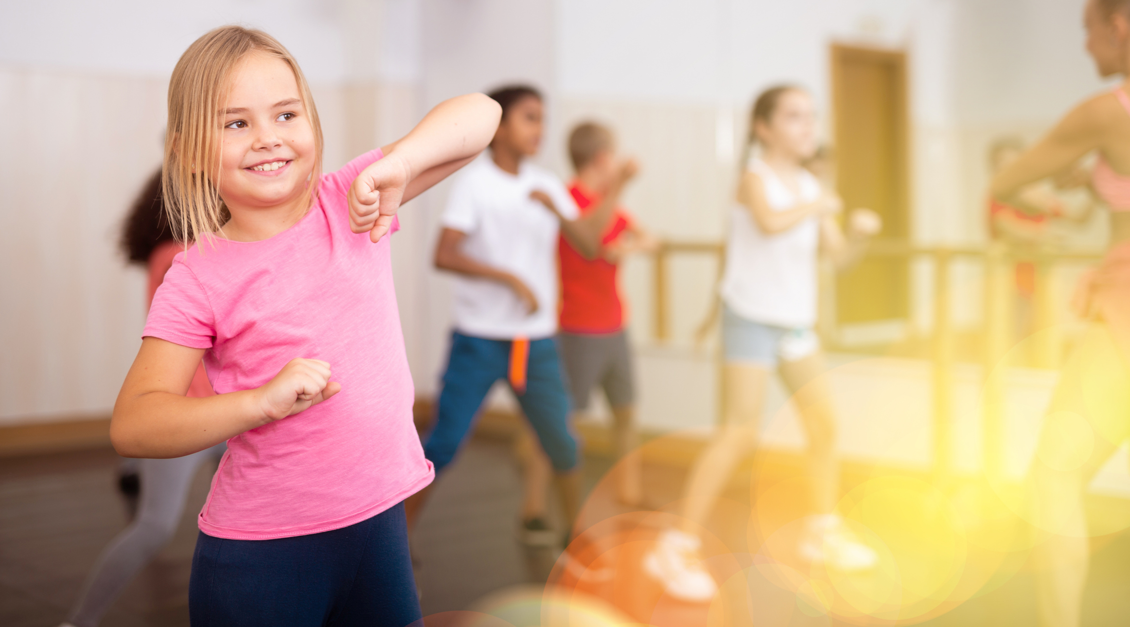 Girl exercising in group during Kids' fitness class at Jasper Park Lodge