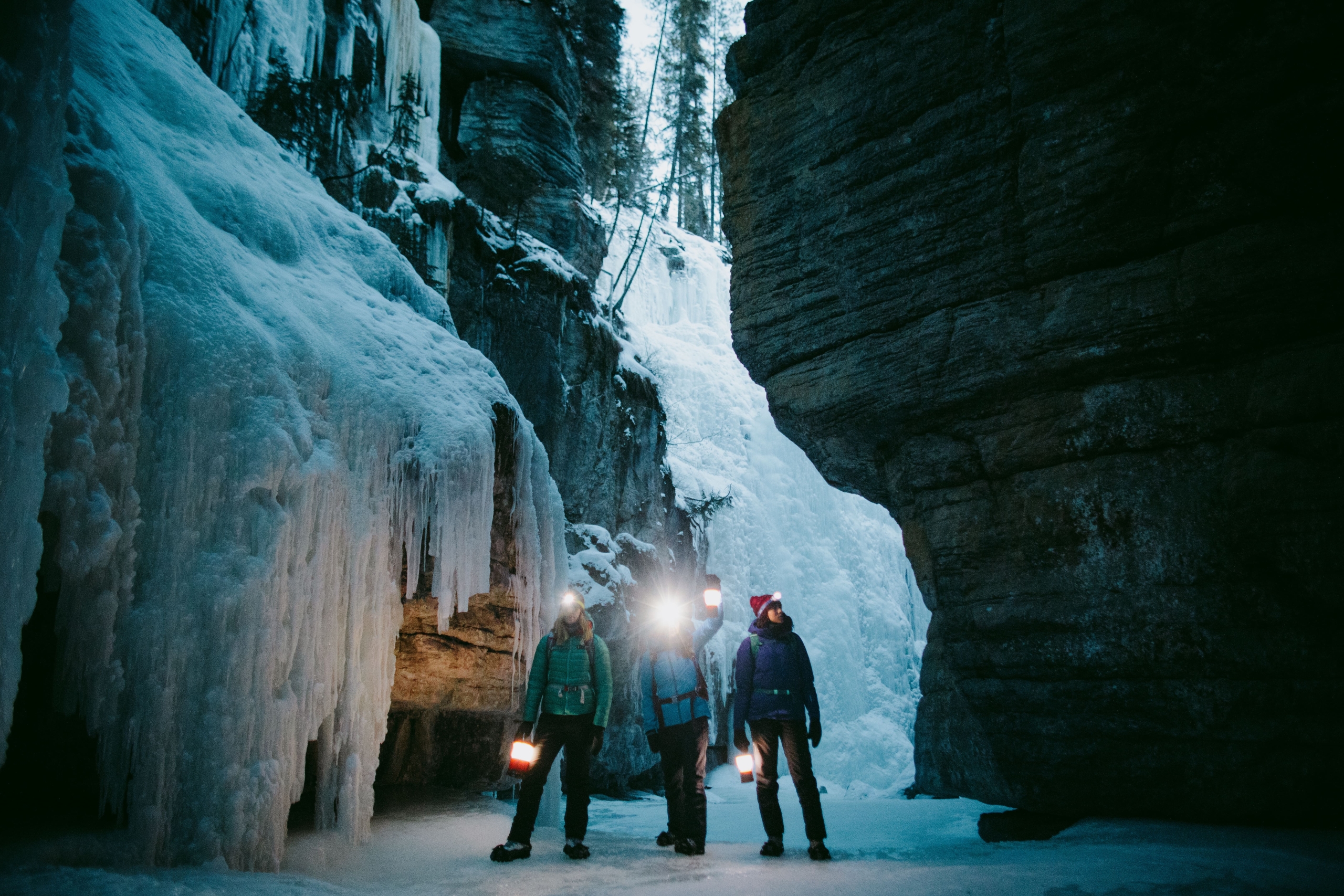 A group explores the ice caves of Magline Canyon in Jasper