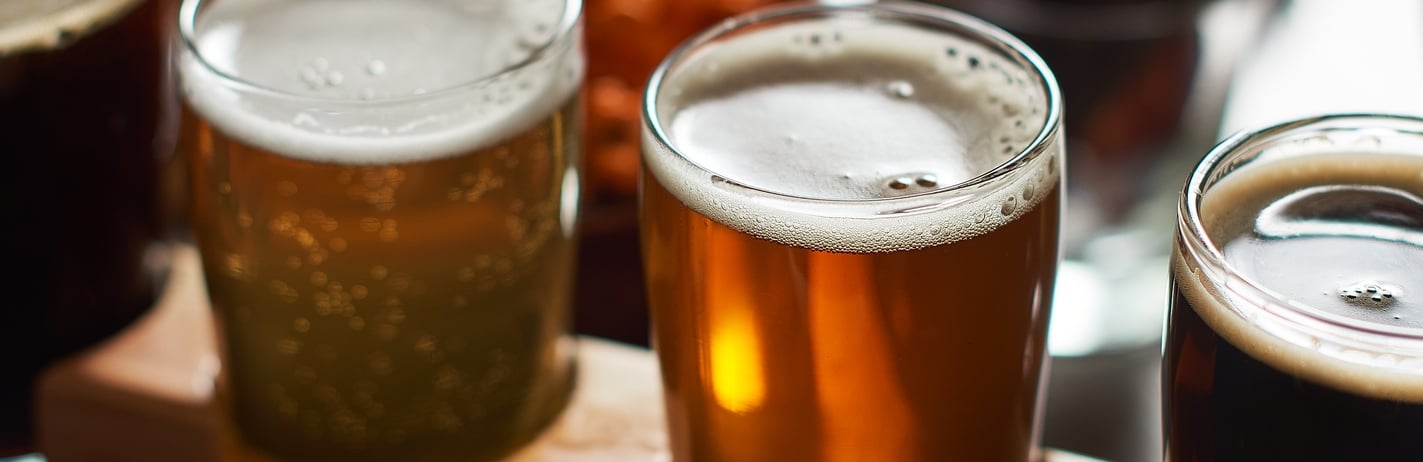Craft beer flight on a table.