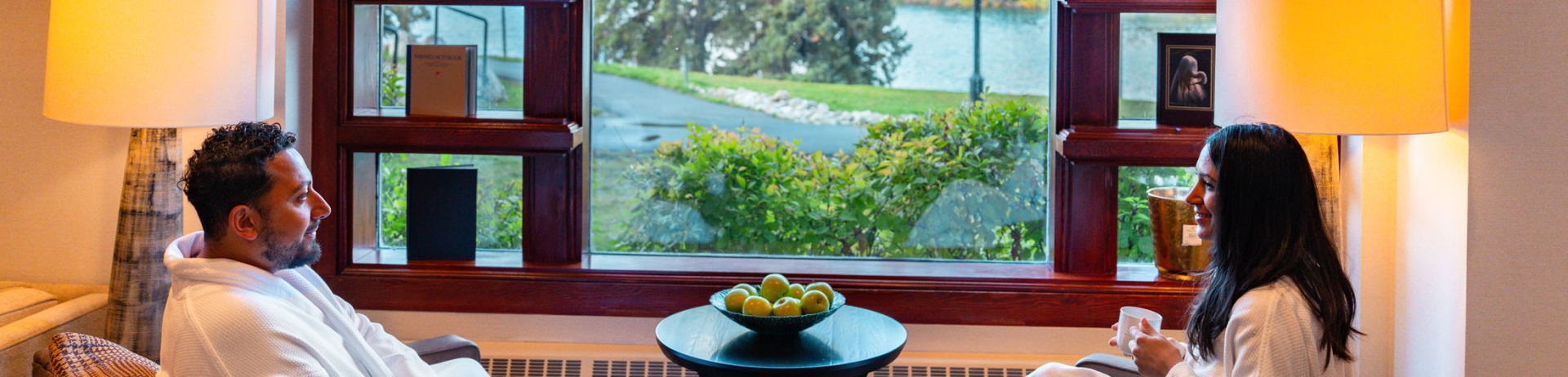 Coupe relaxing in robes in the spa lounge