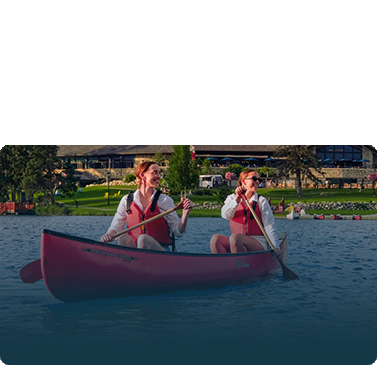 Friends enjoying a canoe ride in Lac Beauvert