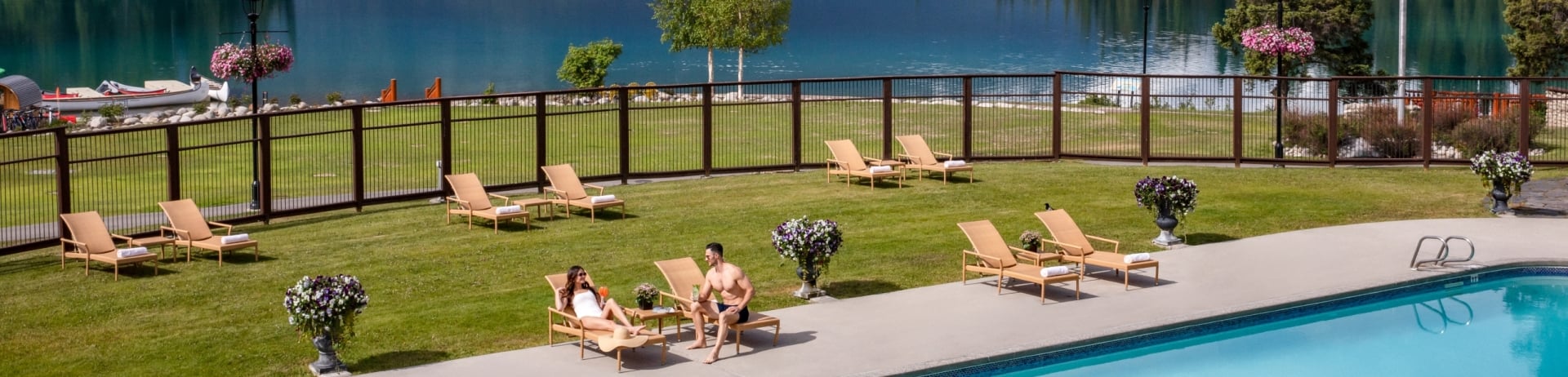 couple at pool with view of lac beauvert