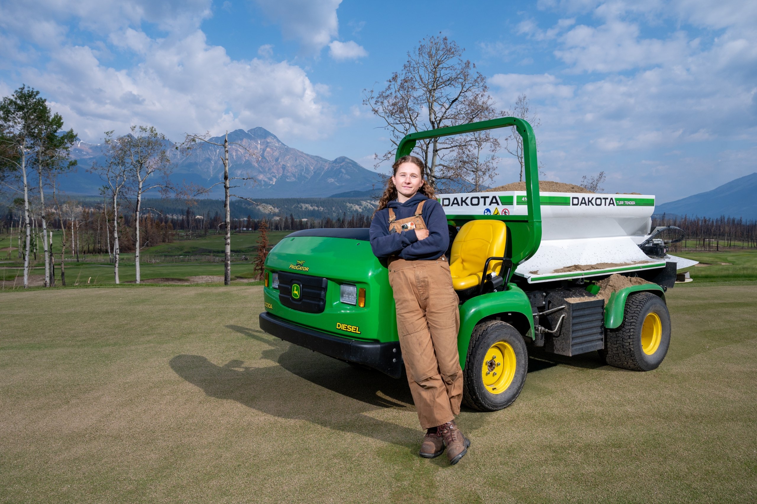 Images of the Grounds Irrigation Supervisor in front of a vehicle at Fairmont Jasper Park Lodge Golf Course