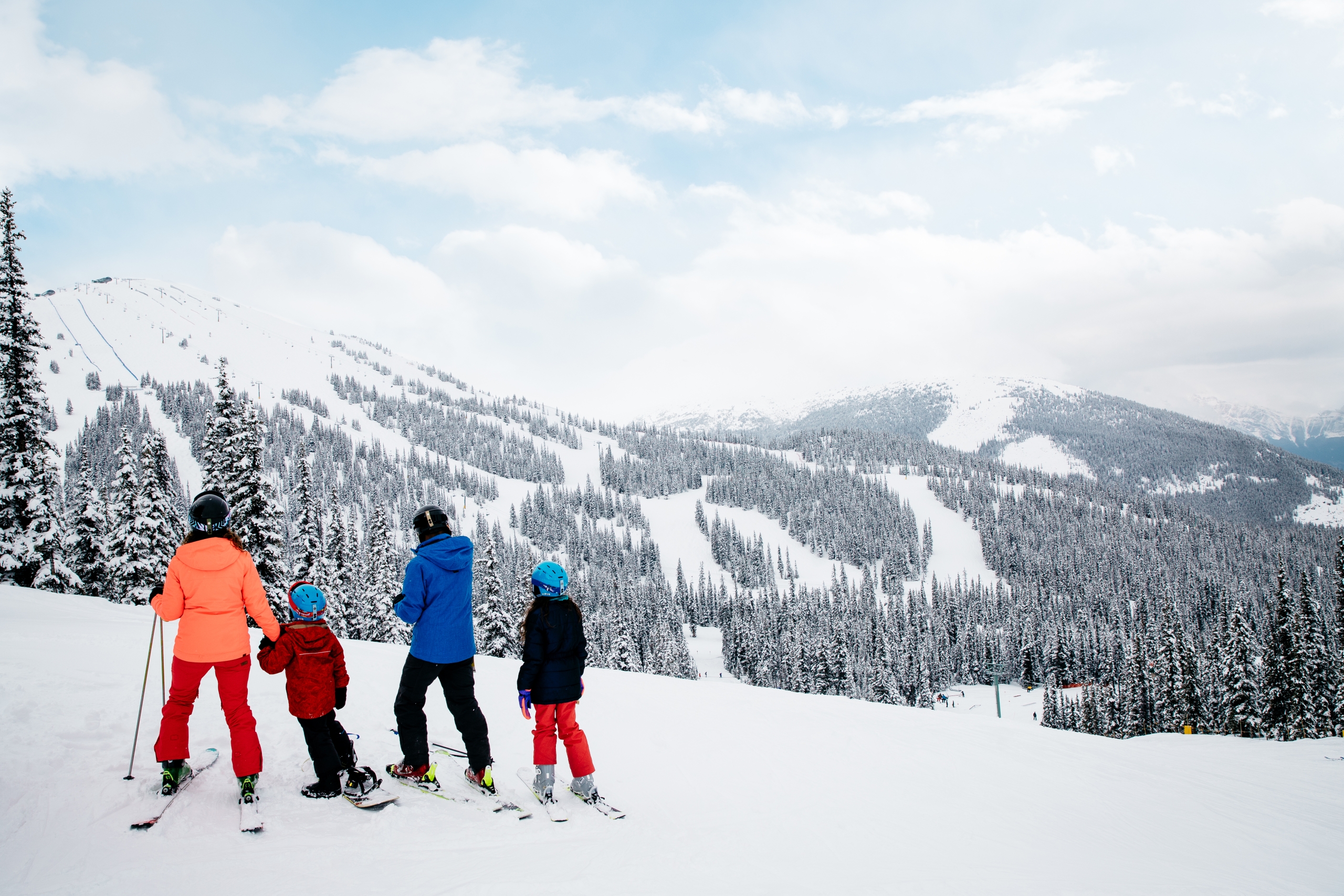 Family skiing and snowboarding at Marmot Basin