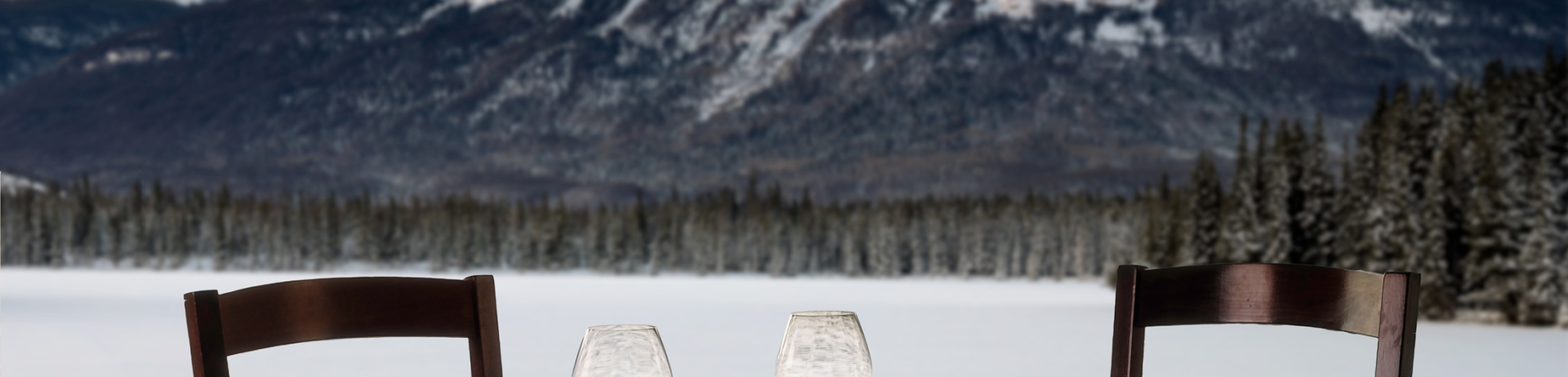 Orso Trattoria table setting with a winter mountain view