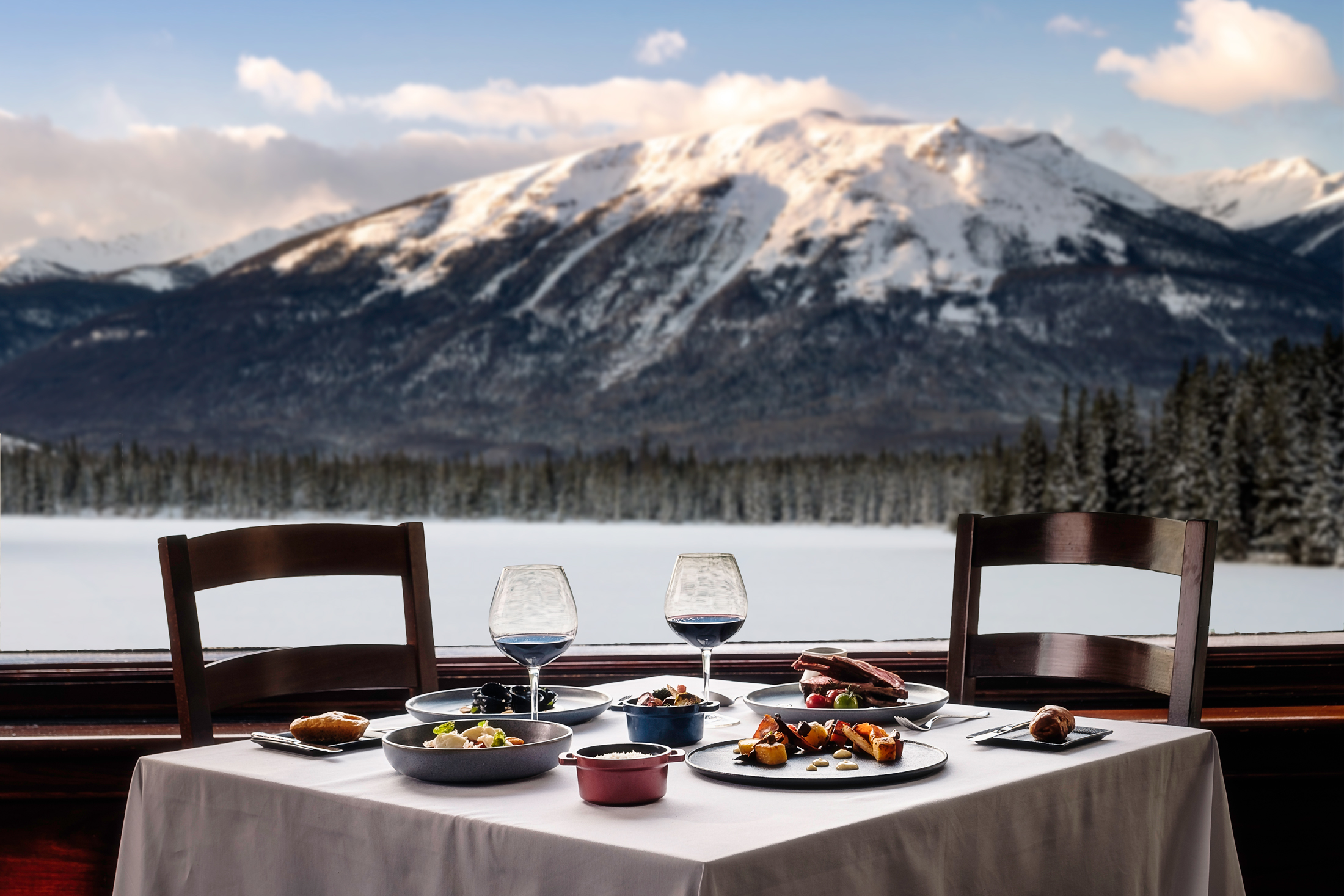 Orso Trattoria table setting with a winter mountain view