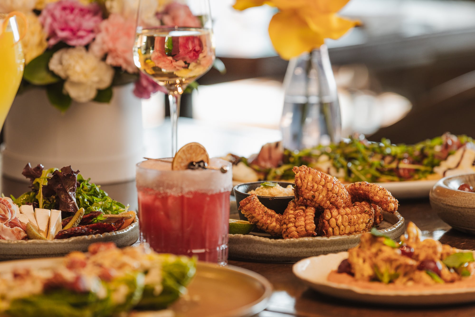 Table filled with appetizers and main dishes