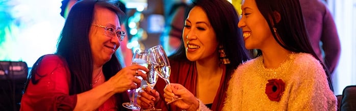 3 Women celebrating Christmas.