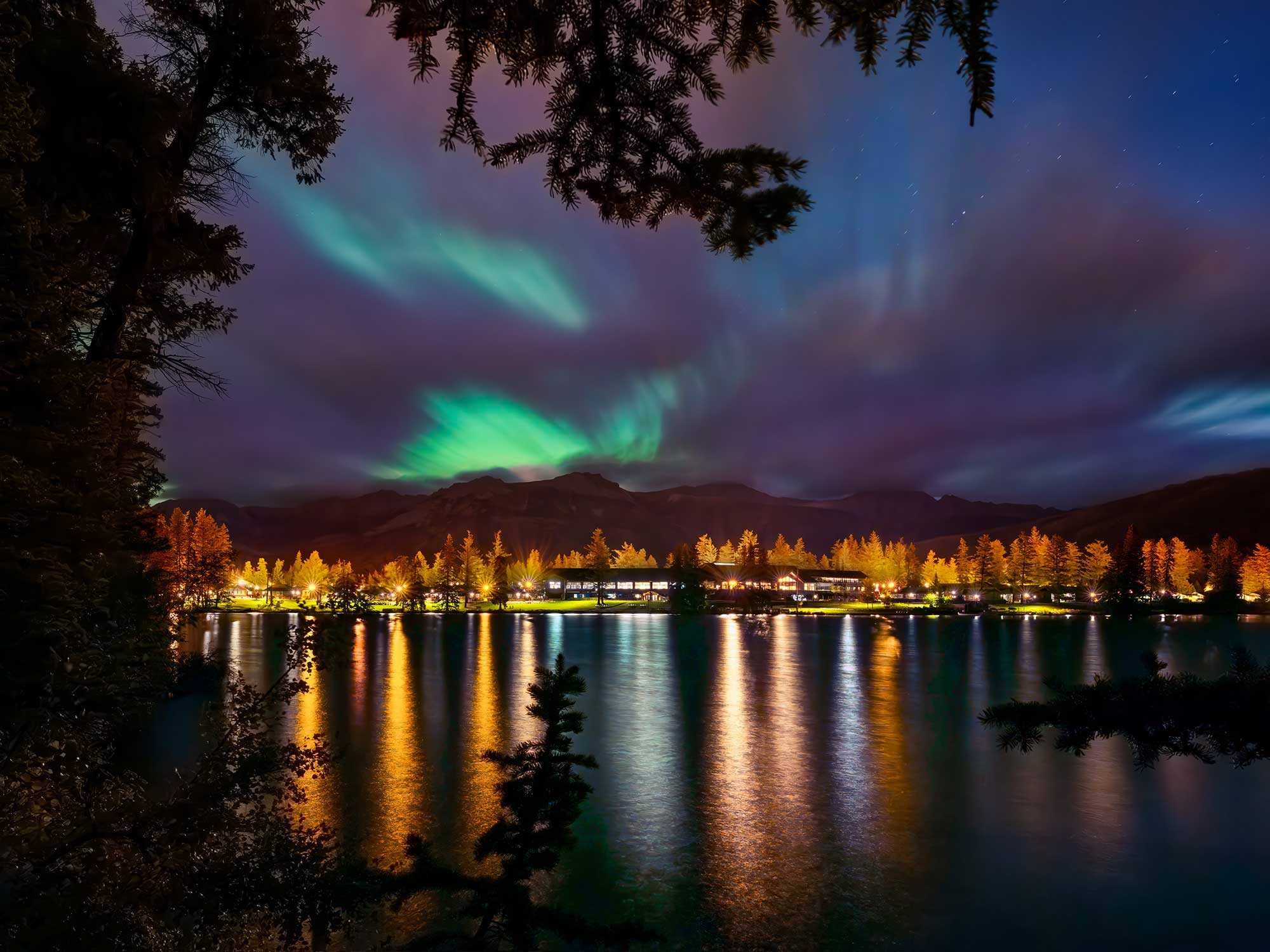 northern lights over Fairmont Jasper Park Lodge exterior lac beauvert