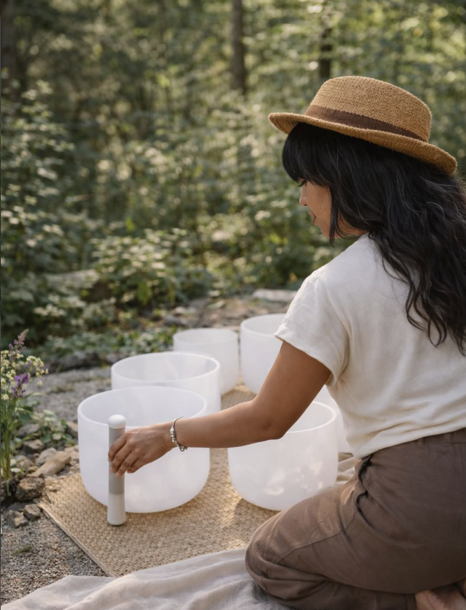 Woman leading a sound bath.