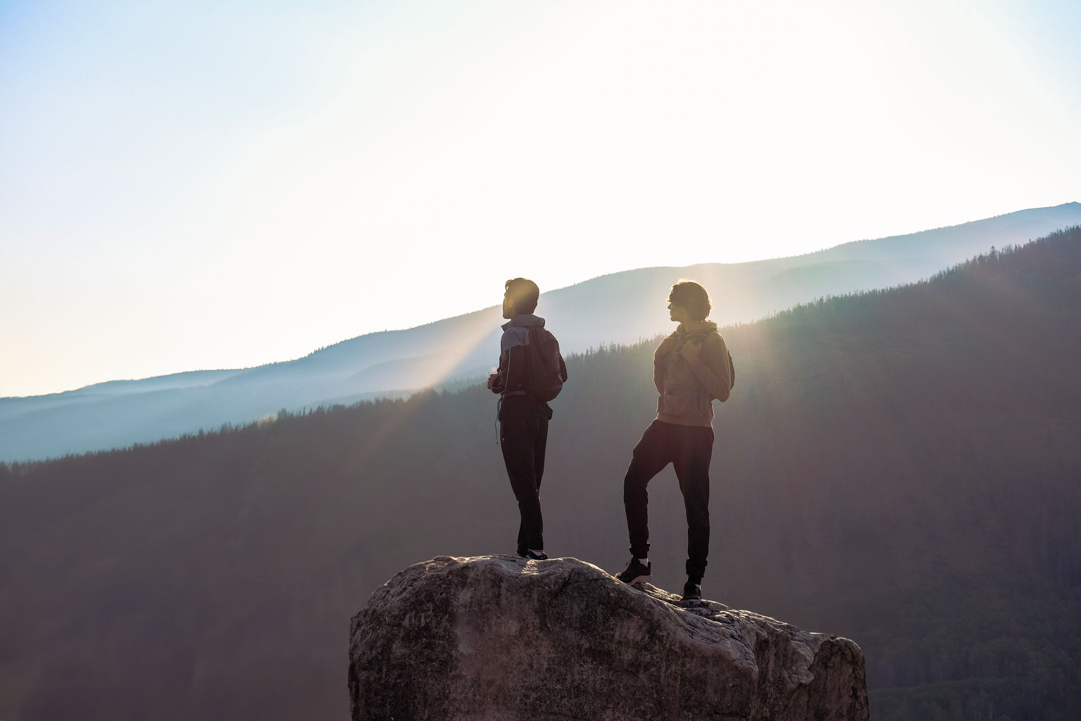 Two men hiking Old Fort Point at Sunset