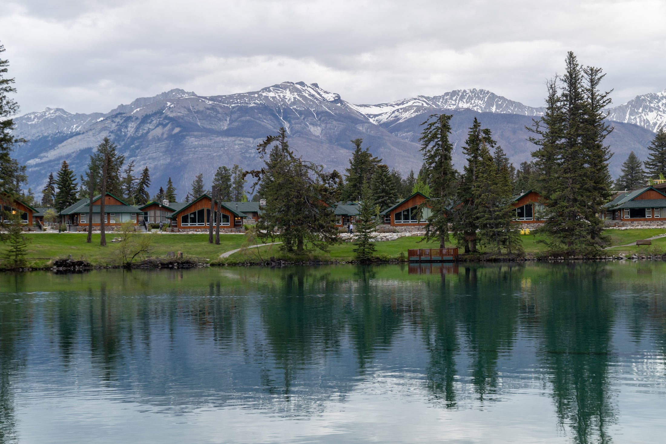 Exterior view of Fairmont Jasper Park cabins as seen from across Lac Beauvert