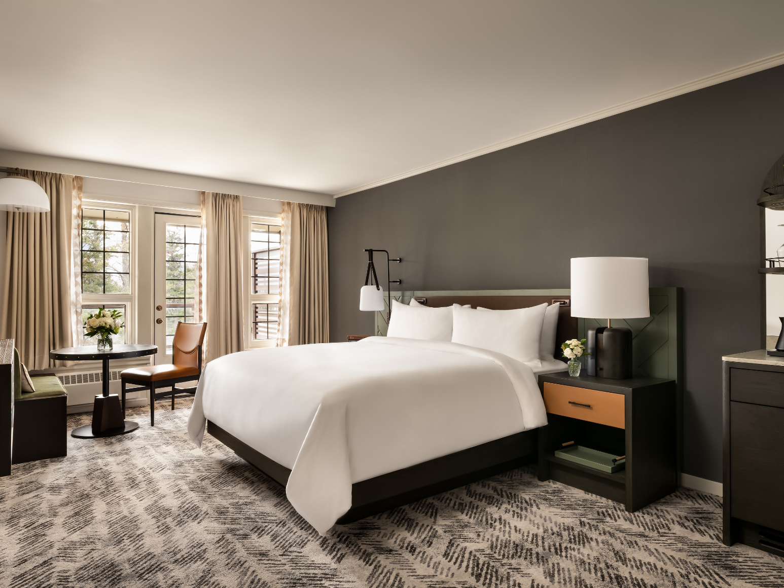 A hotel room with a king size bed.