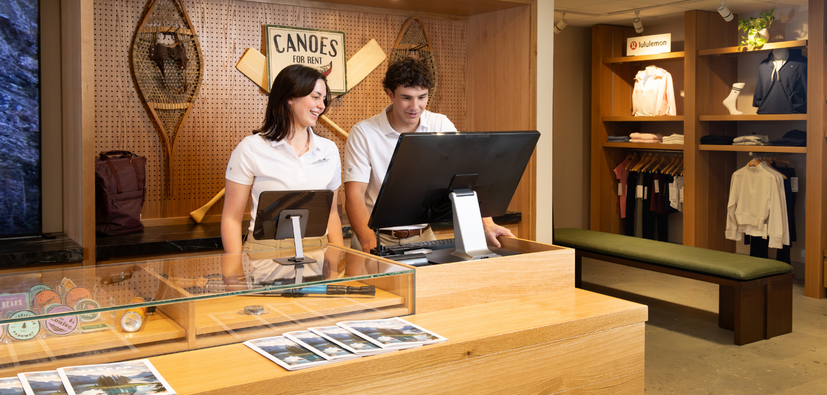 Two staff members collaborating in an adventure centre.
