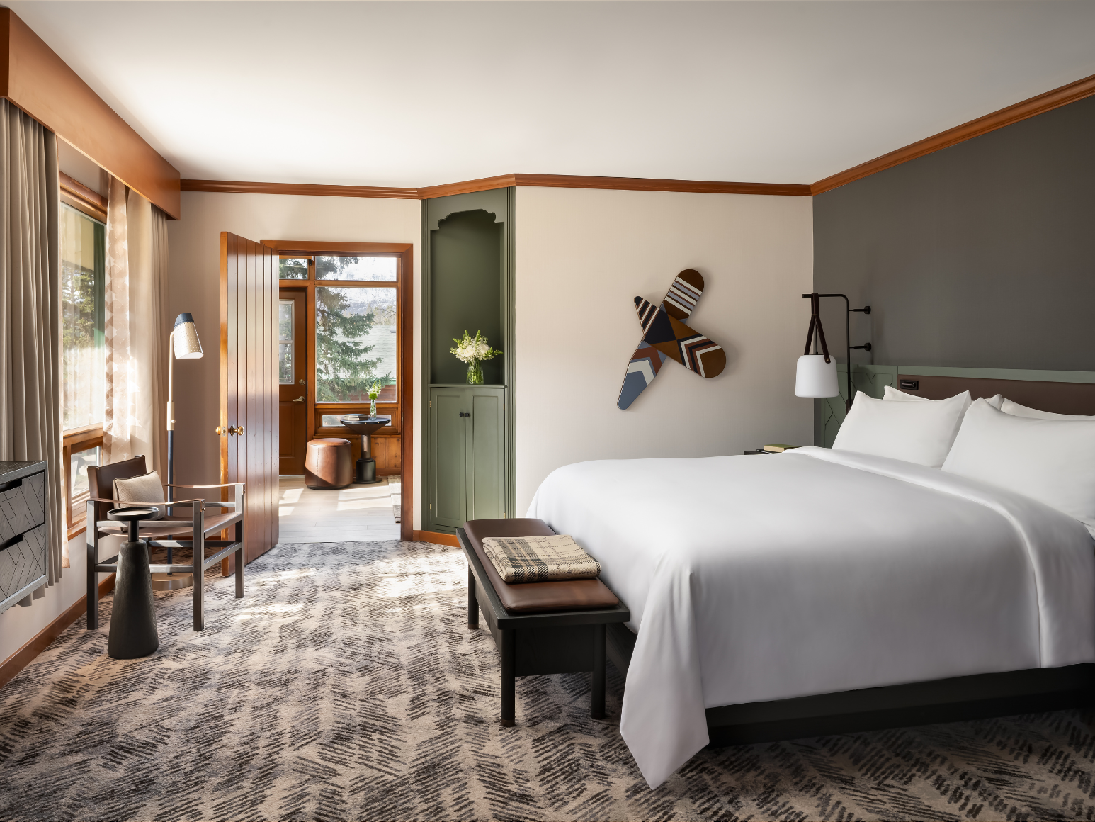 A hotel room with a king size bed.