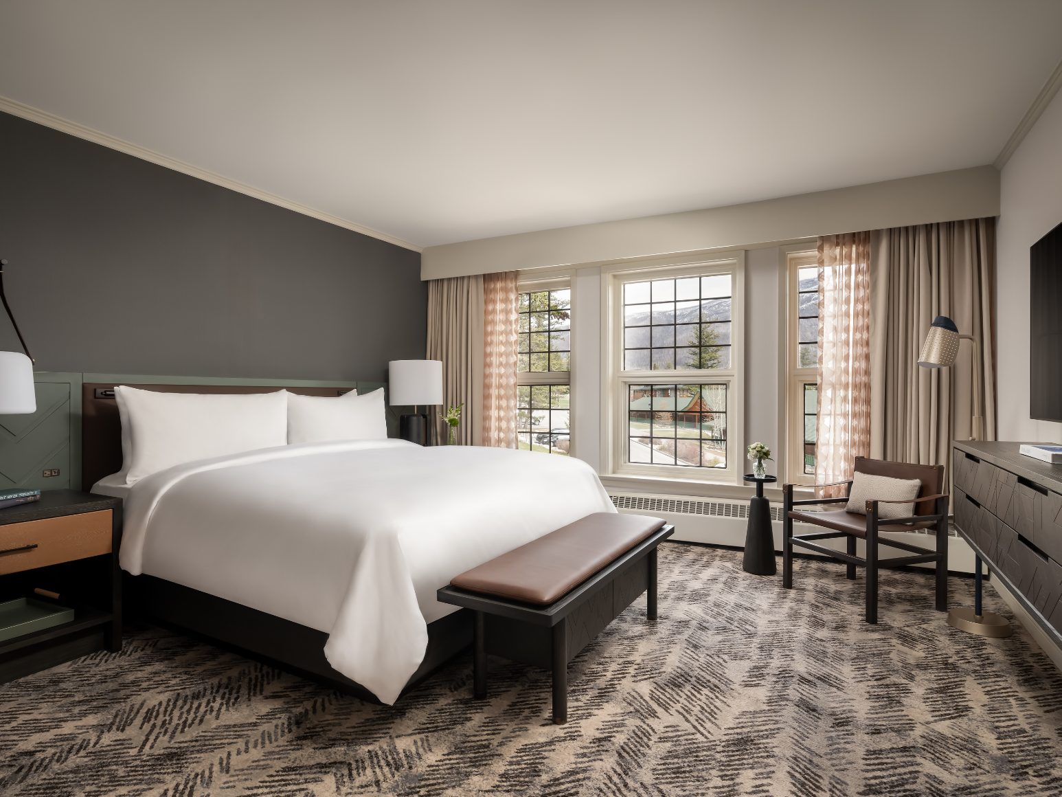 A hotel room with a king size bed.