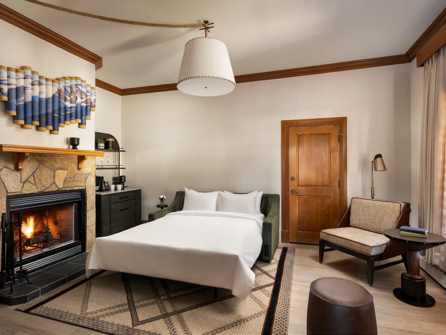 A hotel room with a sofa bed.