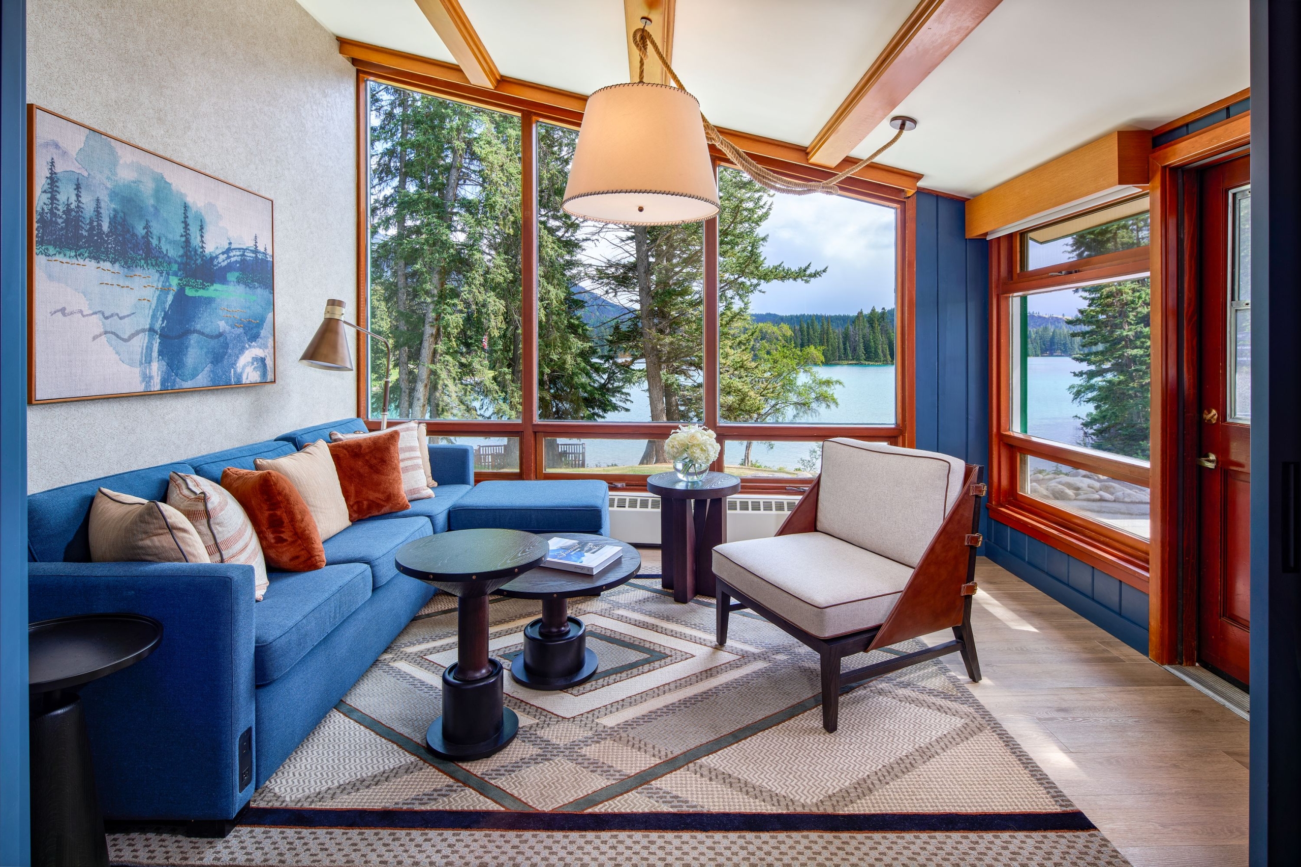 A hotel suite in the summertime with a beautiful alpine view.