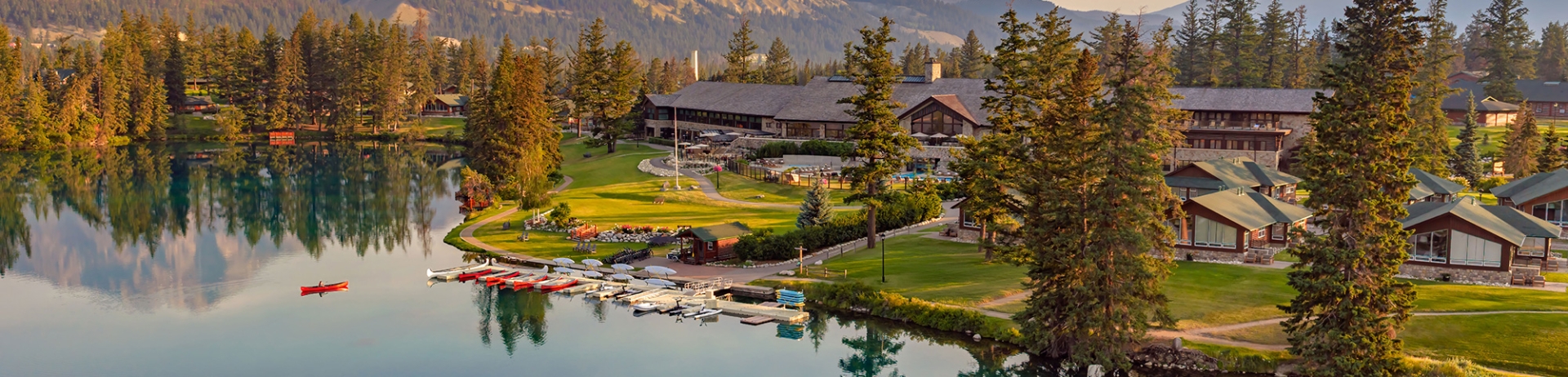 Aerial view of Fairmont Jasper Park Lodge and a canoe on Lac Beauvert.