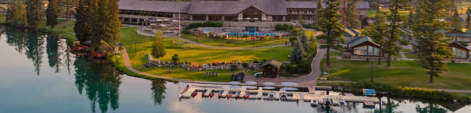 Aerial view of Fairmont Jasper Park Lodge and a canoe on Lac Beauvert.