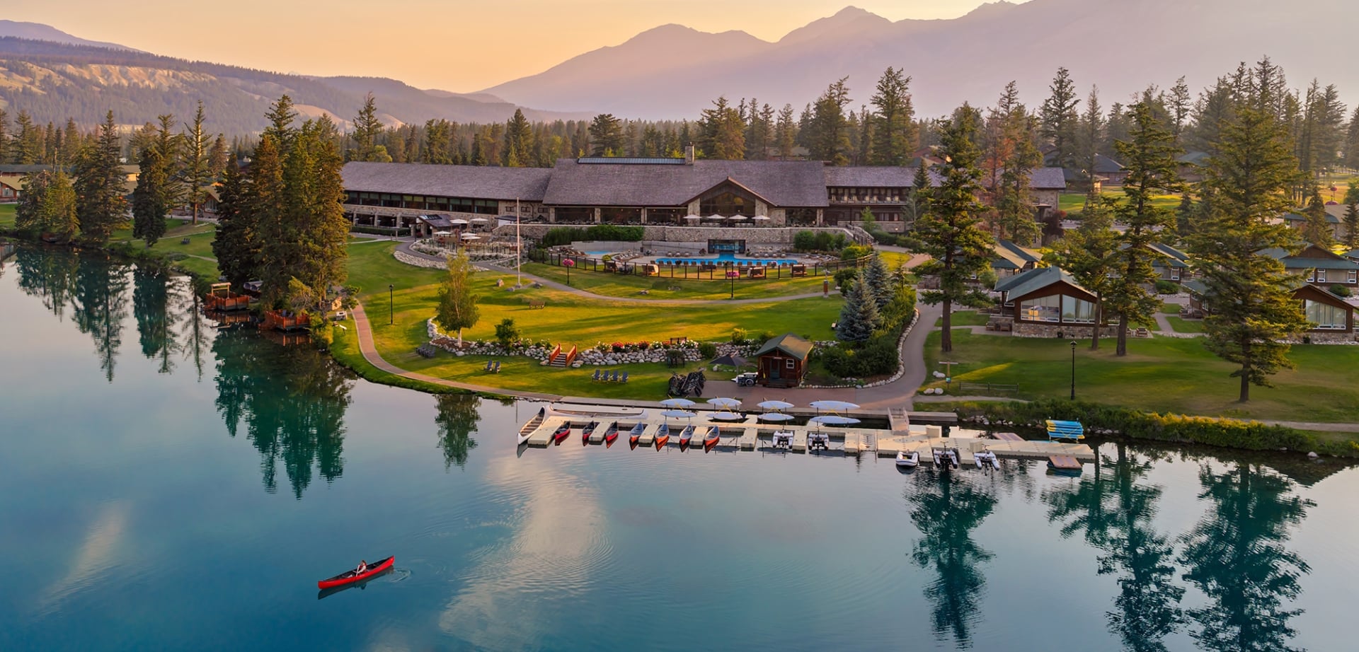 Aerial view of Fairmont Jasper Park Lodge and a canoe on Lac Beauvert.