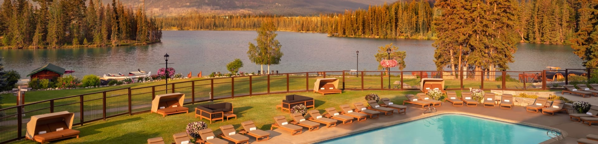 Architectural photo of the outdoor pool over looking Lac Beauvert at Fairmont Jasper Park Lodge
